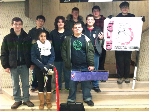 Members of the Island Trees High School robotics team display the contents of the kit of parts.